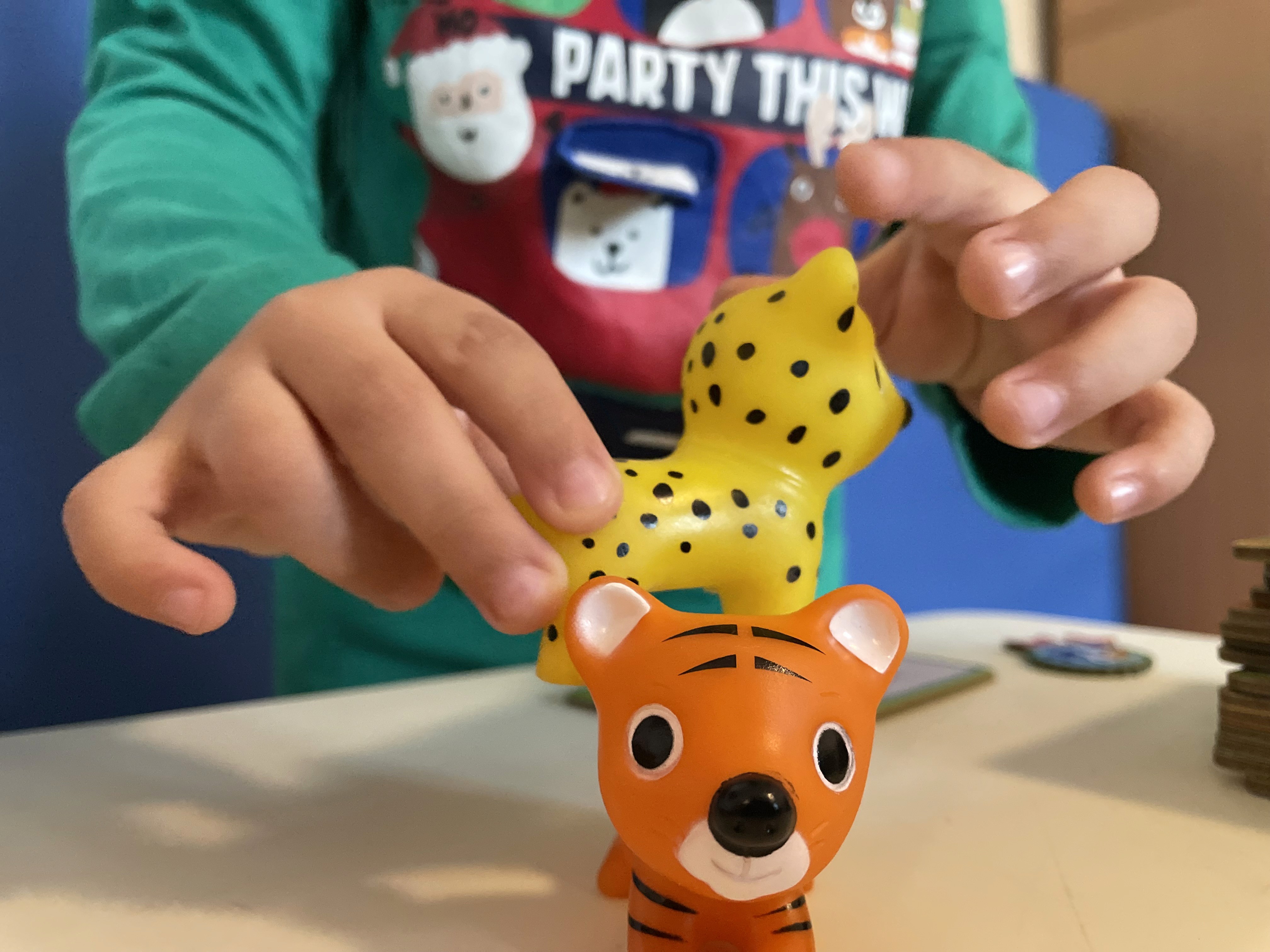 Parent and child playing board games together