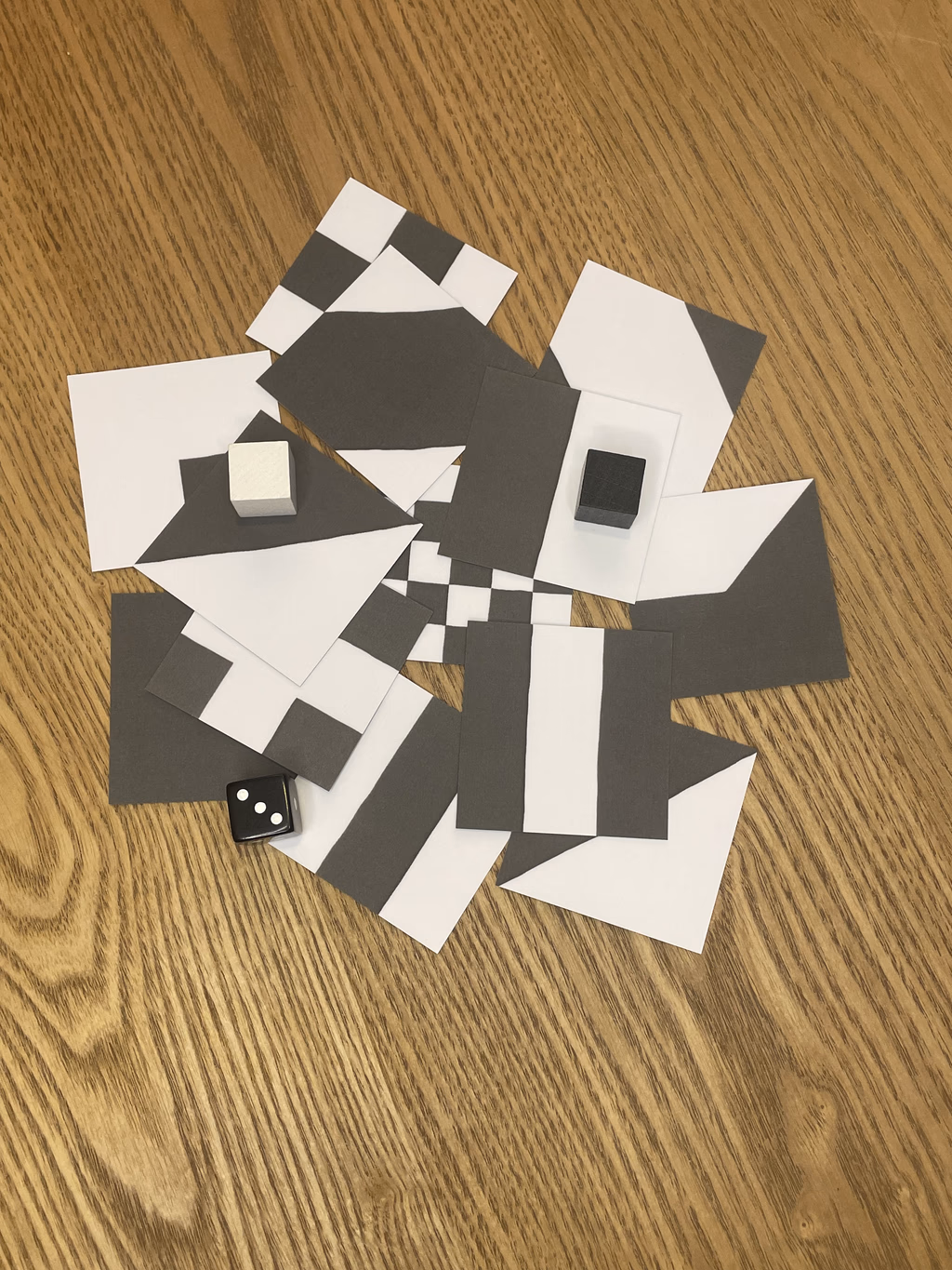 CONTRAST game components showing tiles, pawns, and dice