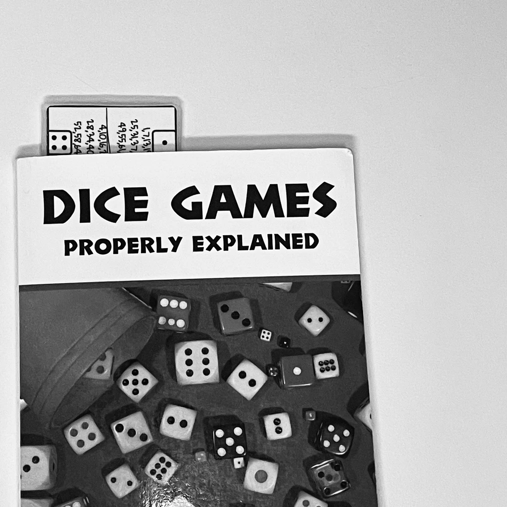 MARK & PLAY bookmark in use with a book